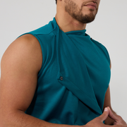 Close up of a sleeveless, high neck wrap top in teal coloured jersey, showing the wrap partially open and the black snap fastening closure.